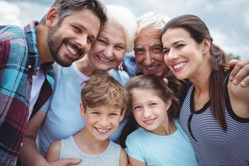 Happy multi-generation family standing  outdoors