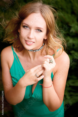 Portrait of a beautiful woman in a green dress