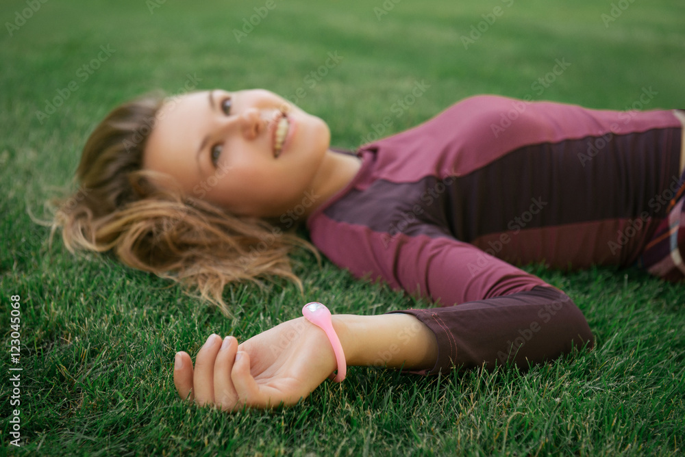 Active woman wearing fitness tracker