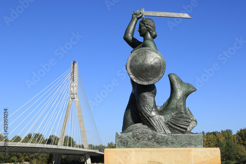 Warsaw, Mermaid statue and Swietokrzyski bridge across the Vistula river