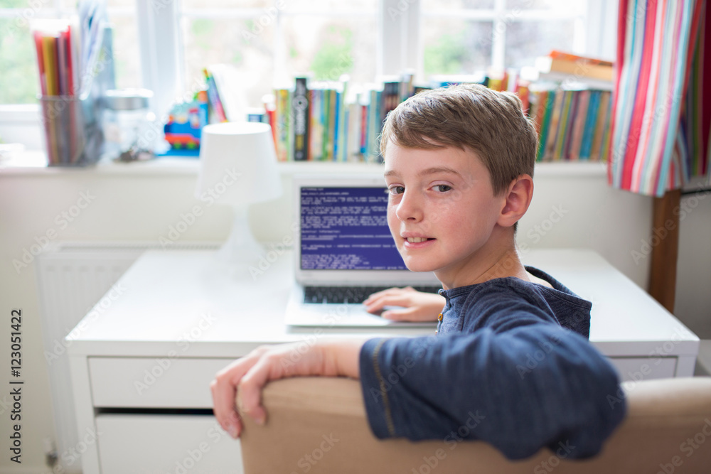 Teenage Boy In Bedroom Writing Computer Code Teenage Boy In Bedroom Writing Computer Code