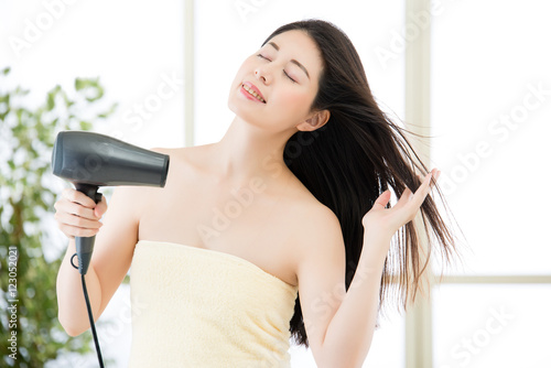 asian beauty woman hair dryer to drying hair after shower