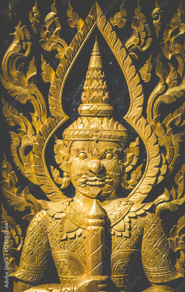 art door carving guardian giant in the temple 