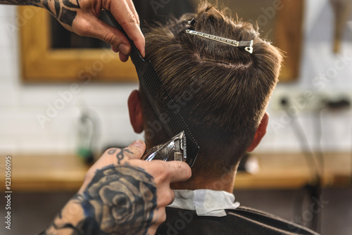 boy getting a haircut indoors