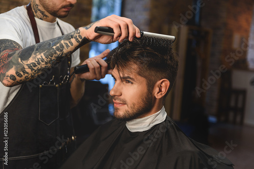 stylish macho getting haircut