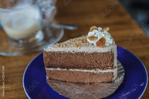 Portion of cake on wooden table photo