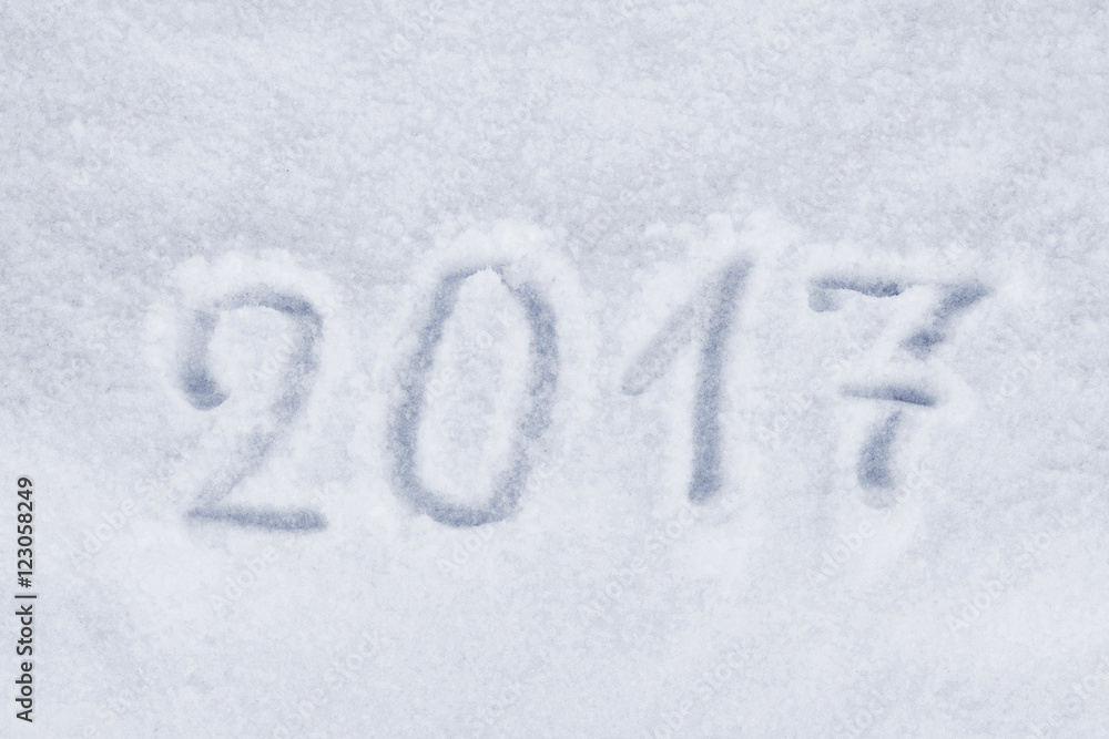 2017 New Year paint on snow. New Year on the doorstep. Happy holiday Mary Christmas. 2017 New Year paint on snow. New Year on the doorstep. Happy holiday Mary Christmas.