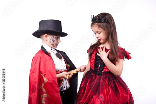 a boy and a girl vampire witch on a white background