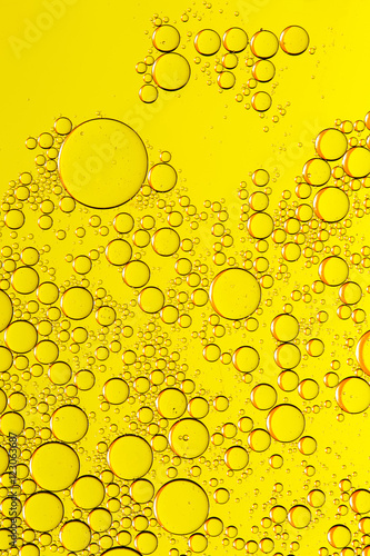 Abstract yellow fluid with bubbles.