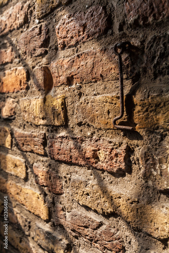 Ancient brick wall and the hook inside the new Church in Delft,