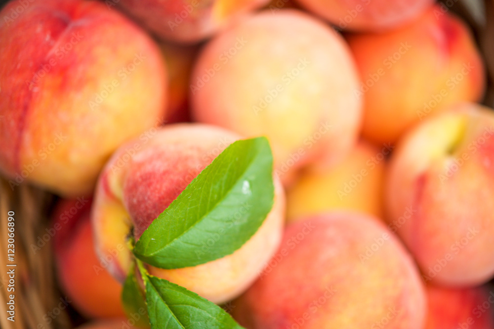 Close up of a basket of ripe peaches Close up of a basket of ripe peaches
