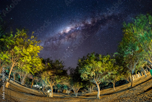 Camping under starry sky and Milky Way arc  with details of its colorful core  outstandingly bright  captured in Southern Africa. Adventure into the wild.