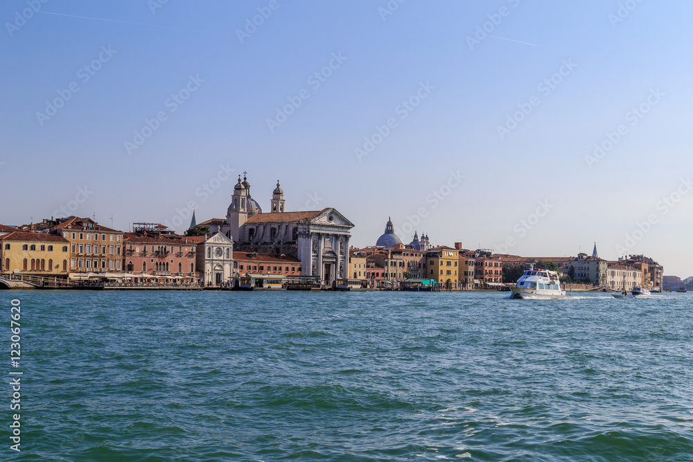 The boat floats on the Giudecca Canal in the Italian city of Venice