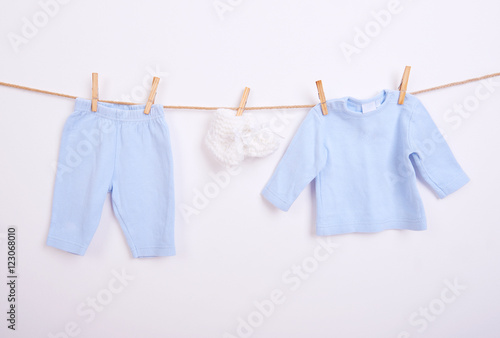 Baby goods hanging on the clothesline, white