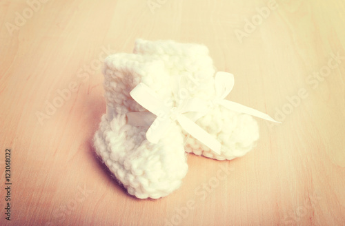 Wallpaper Mural Knitted baby socks on against the backdrop Torontodigital.ca