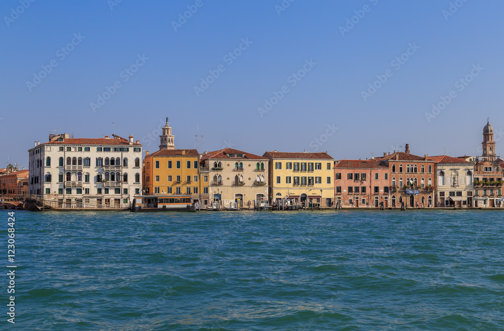 View of the embankment of the Giudecca canal in Venice, summer day
