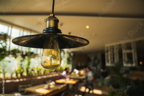 Lamps with Edison in the interior of a modern cafe. © galaganov