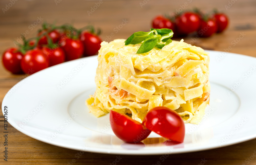 close-up of plate of pasta and smoked salmon with tomato close-up of plate of pasta and smoked salmon with tomato
