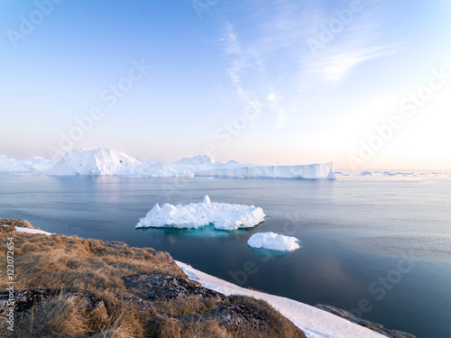 icebergs are in icefjord at Greenland