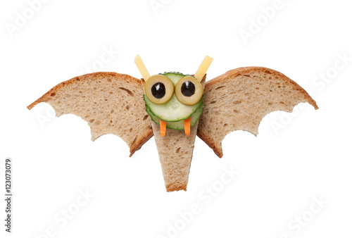Halloween bat made of bread on white background