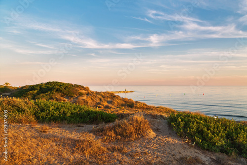 Sunset landscape with coast of the sea