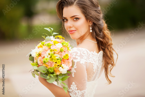 close up of young woman with bouquet of flowers