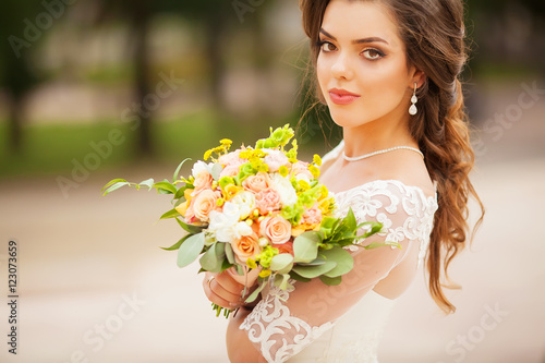 Beautiful original wedding bouquet in the bride hands