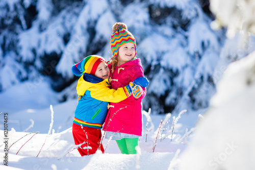 Children playing in snowy winter park