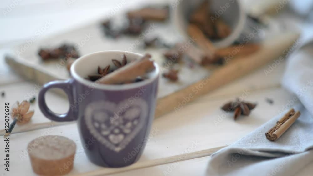 Cups with anise, cinnamon, cloves and pepper on a wooden old table. Cups with anise, cinnamon, cloves and pepper on a wooden old table.