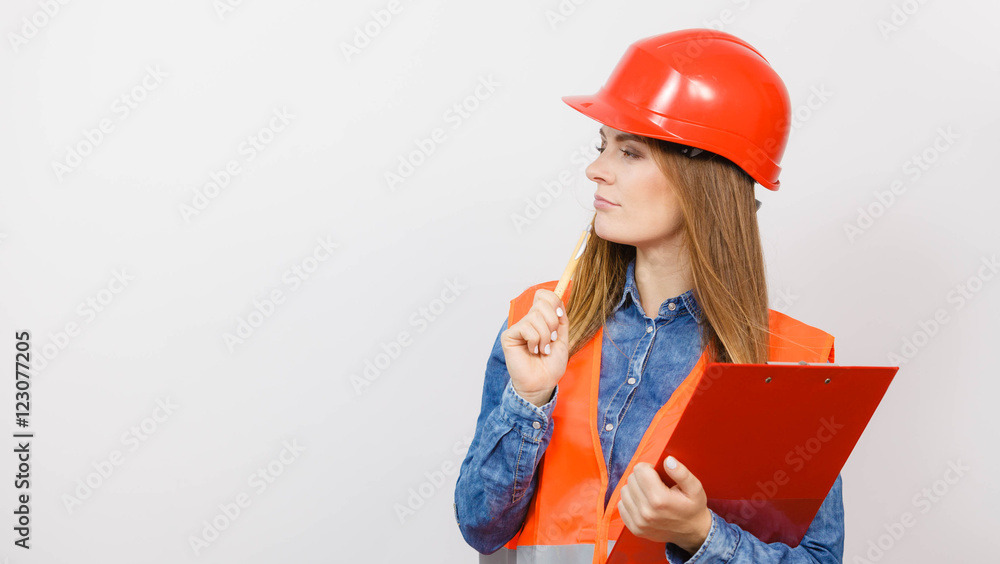 Woman engineer construction builder in helmet. Woman engineer construction builder in helmet.