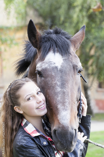 A young girl with a horse © Jovica Varga