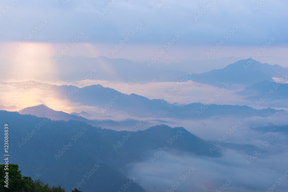 Sunrise scene with the peak of mountain and cloudscape