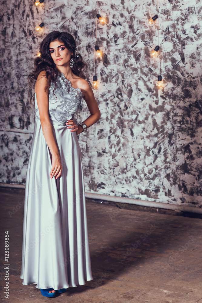 Elegant beautiful brunette posing, smiling, looking at camera. S Elegant beautiful brunette posing, smiling, looking at camera. S