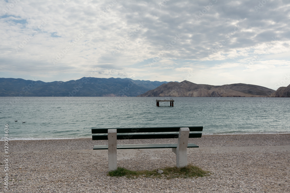 empty bench on the beach , Baska , Croatia