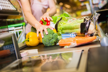 woman buying food at the grocery store