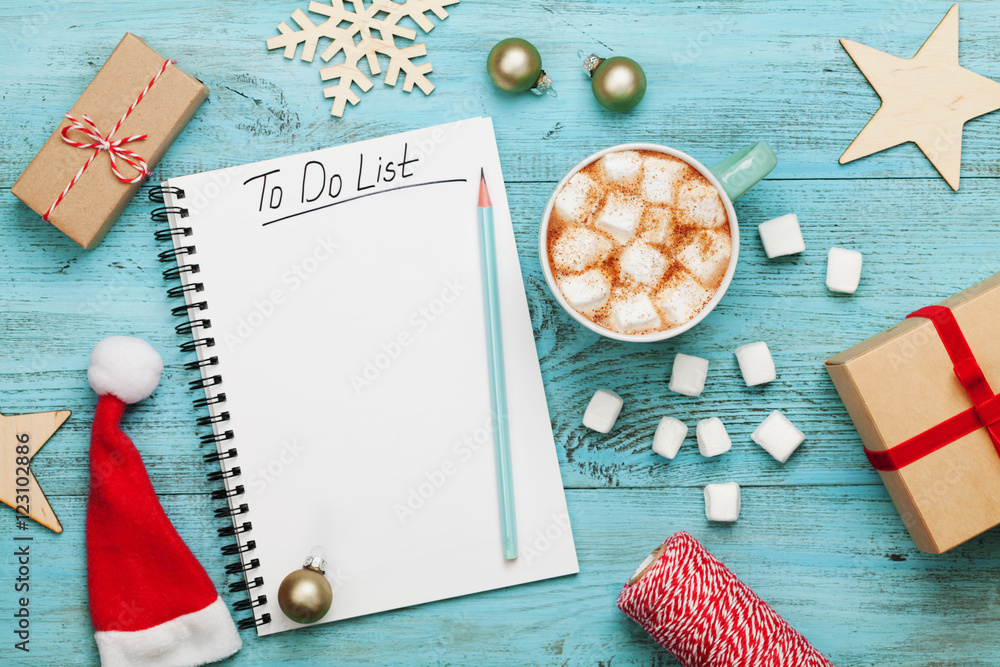Cup of hot cocoa or chocolate with marshmallow, holiday decorations and  notebook with to do list on turquoise vintage table from above, christmas  planning concept. Flat lay style. Stock Photo | Adobe