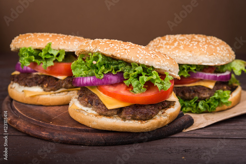 burgers on wooden table