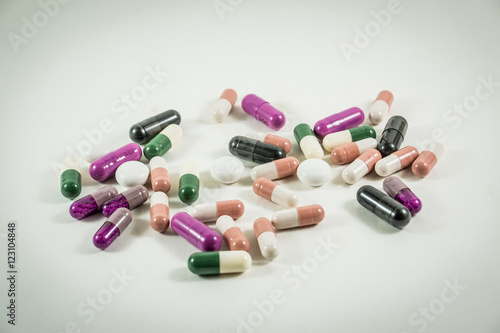 Heap of medicine pills isolated on white background.