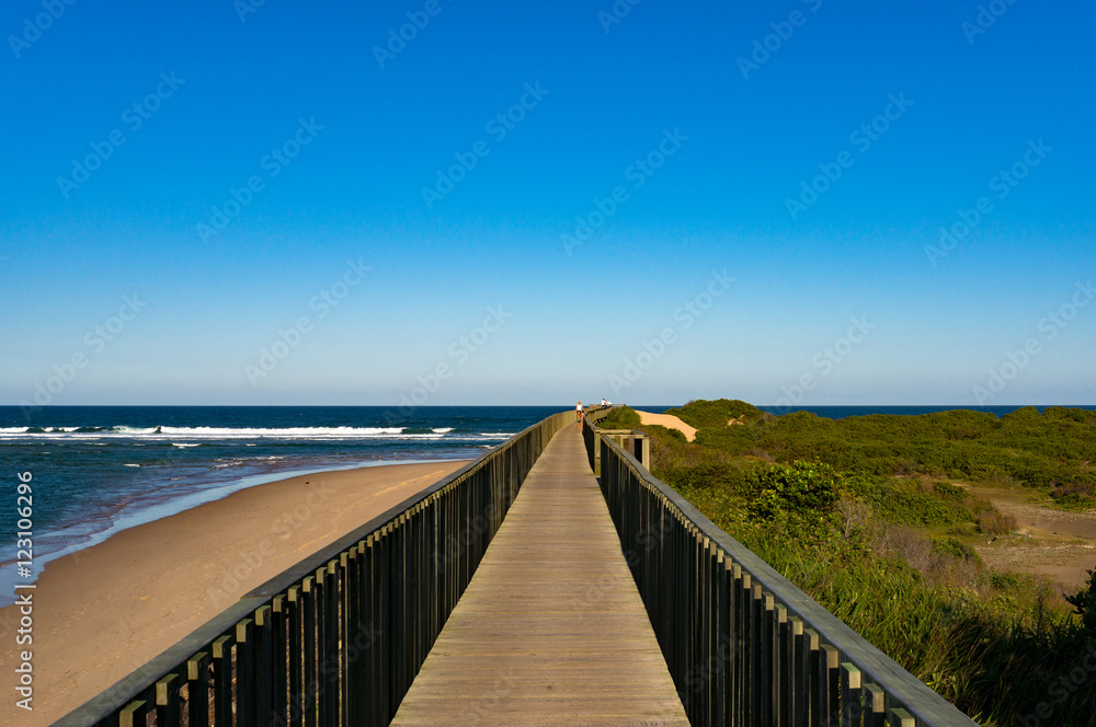 Wooden footpath along ocean coastline in Urunga, New South Wales