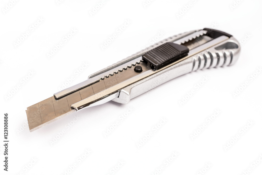 Metal construction scalpel on the white background Metal construction scalpel on the white background
