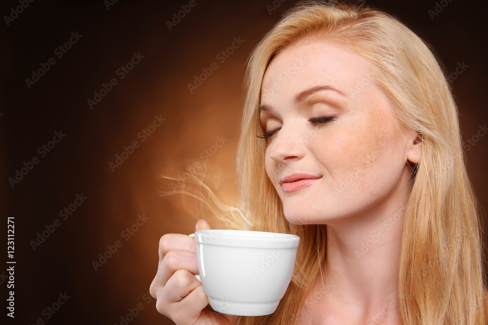 Beautiful girl with cup of coffee on dark background Beautiful girl with cup of coffee on dark background
