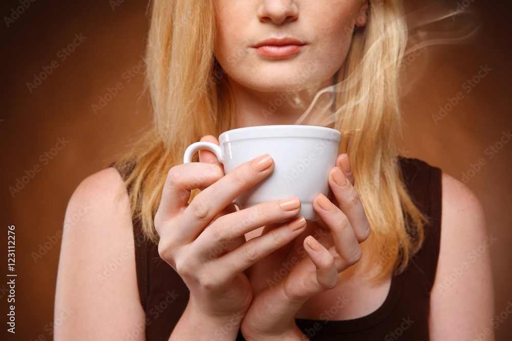 Beautiful girl with cup of coffee on dark background Beautiful girl with cup of coffee on dark background