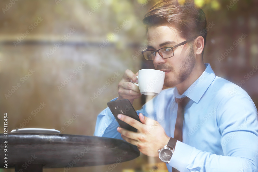 Handsome young lawyer working in cafe Handsome young lawyer working in cafe