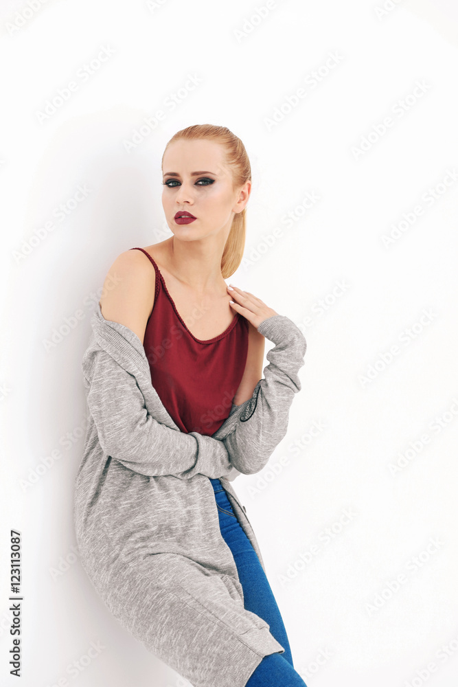 Pretty young blonde woman in casual clothes isolated on white Pretty young blonde woman in casual clothes isolated on white