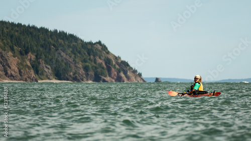 Man kayaking on sea