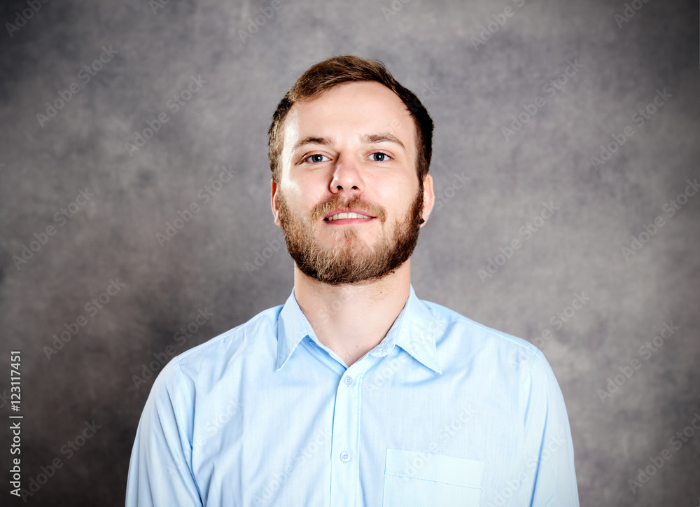 young bearded man in blue shir young bearded man in blue shir