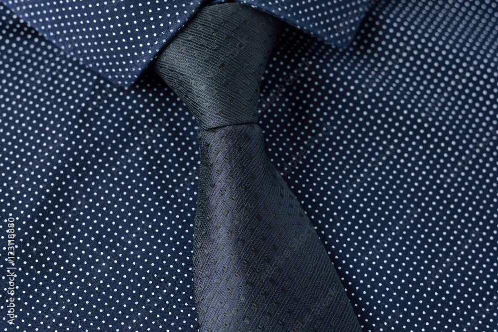 Dark blue tie with polka dots on a blue shirt. Elegance and style. Stock  Photo | Adobe Stock