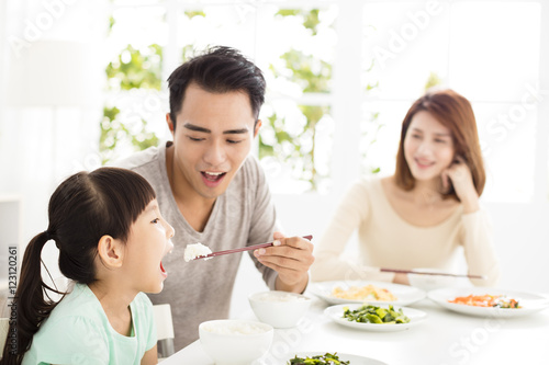 happy young Family enjoy their  dinner