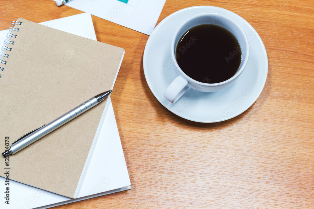 Digital tablet and cup of coffee on old wooden desk Digital tablet and cup of coffee on old wooden desk