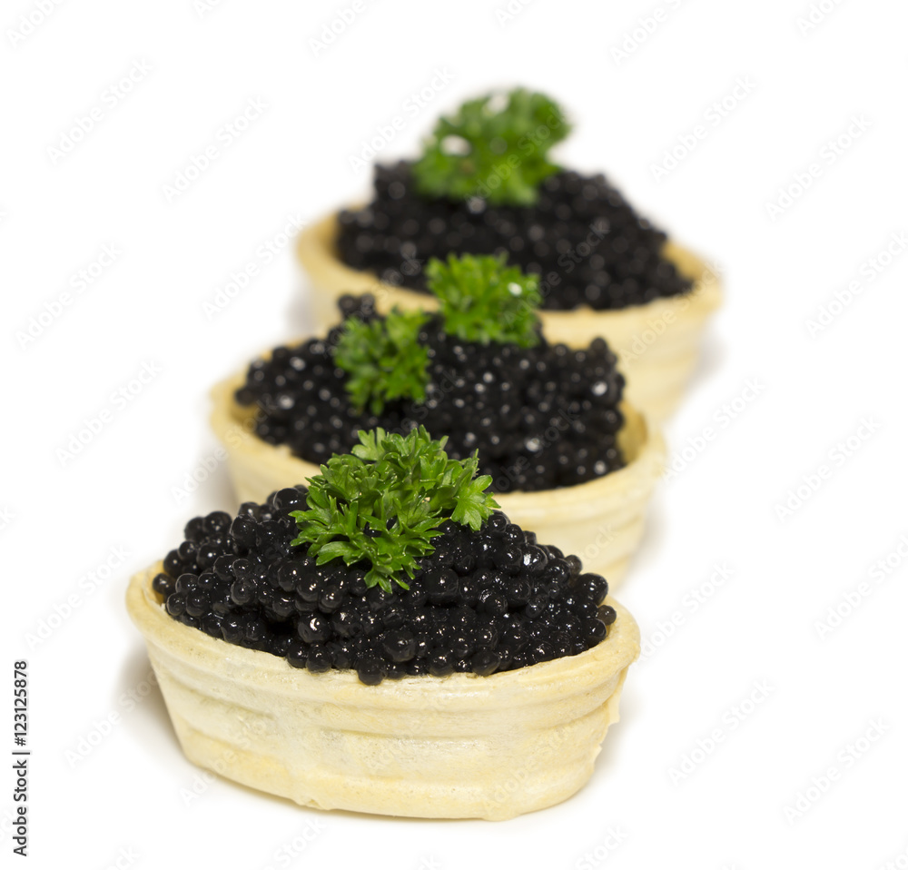 waffle basket with black caviar isolated on white waffle basket with black caviar isolated on white